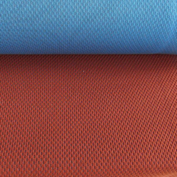 Kvadrat Febrik Plecto 564 roestbruin burnt orange blauw
